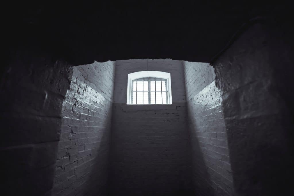 An image of a dark, empty, hallway.